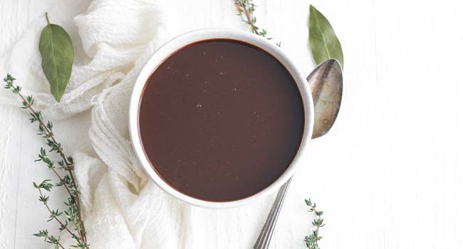 a bowl of bordelaise with herbs