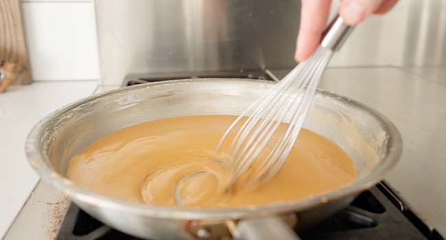 making a dark roux in a pan