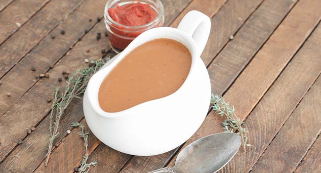 espagnole sauce in a pouring bowl