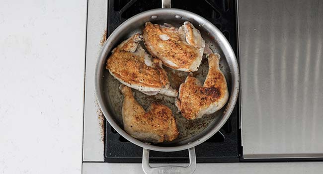 browned chicken in a pan