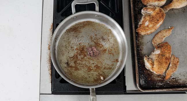 cooking anchovies in a pan