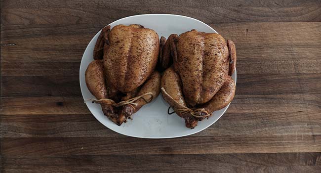 smoked cornish hens on a platter