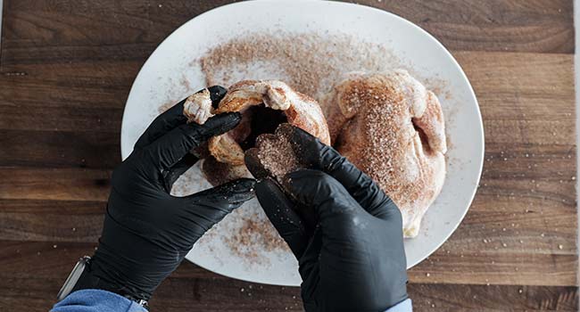 seasoning cornish hens with a spice blend