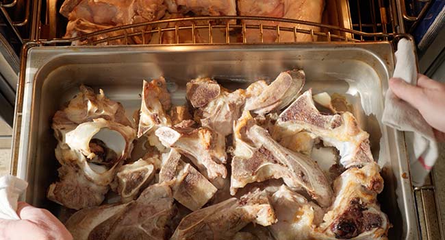 veal bones in pans