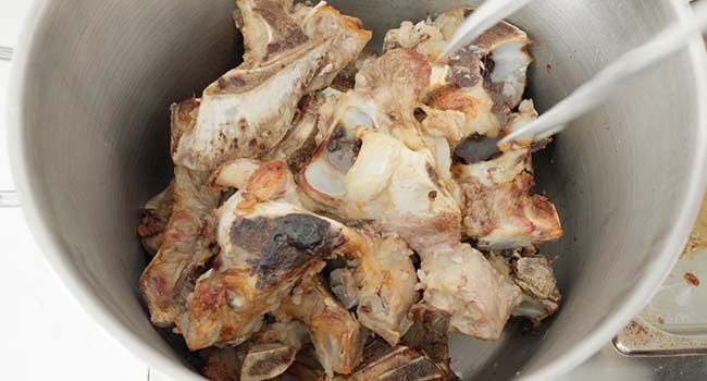 veal bones in a pot