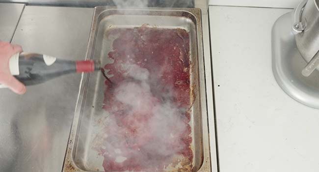 deglazing a pan with red wine