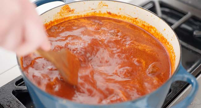 stirring a chili