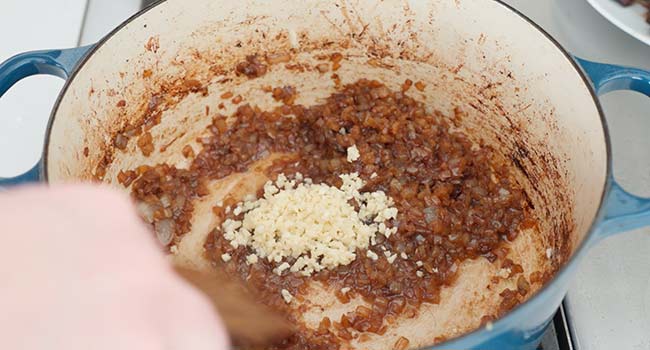 adding garlic to browned onions