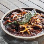 texas chili in a bowl with a jalapeno