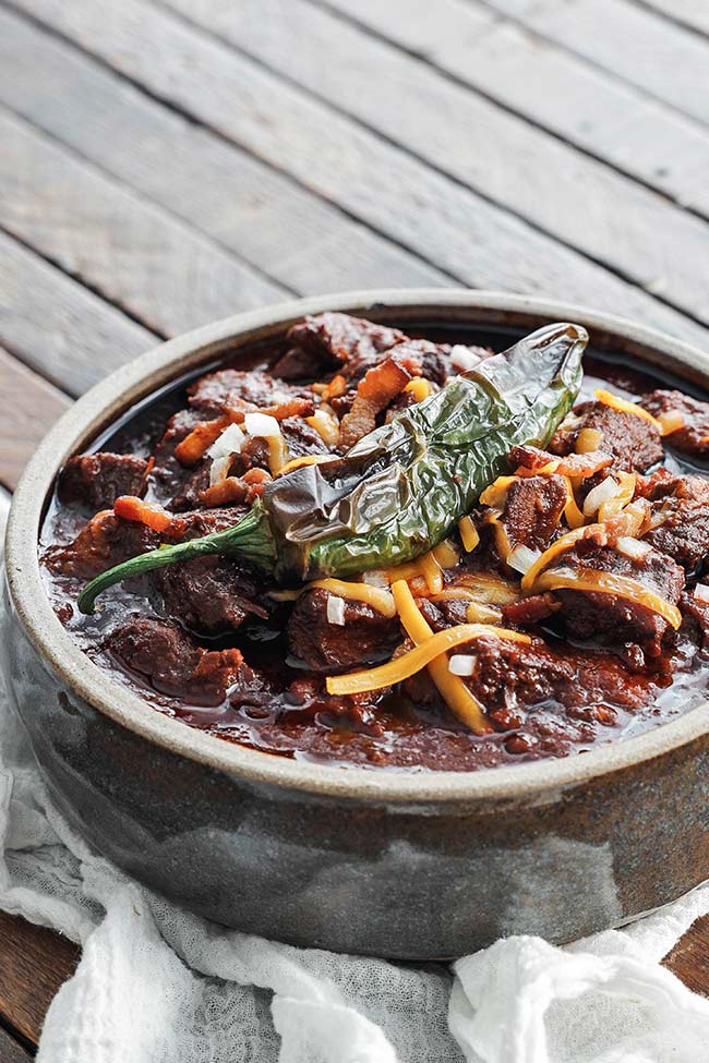 texas chili in a bowl with a jalapeno