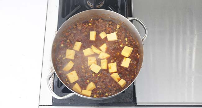 stirring cheese into goulash