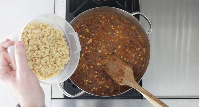 adding pasta to goulash