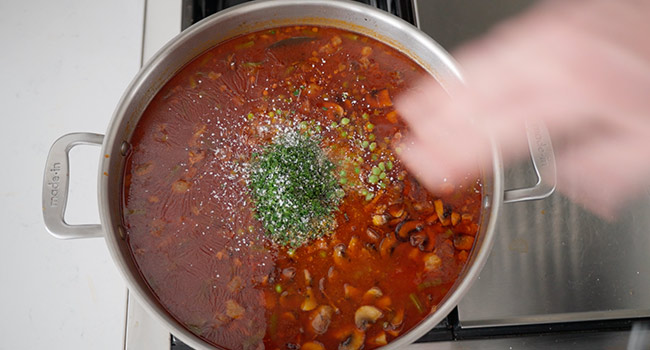 adding herbs to vegetable beef soup