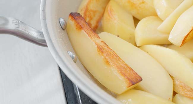 browned potatoes in a pan