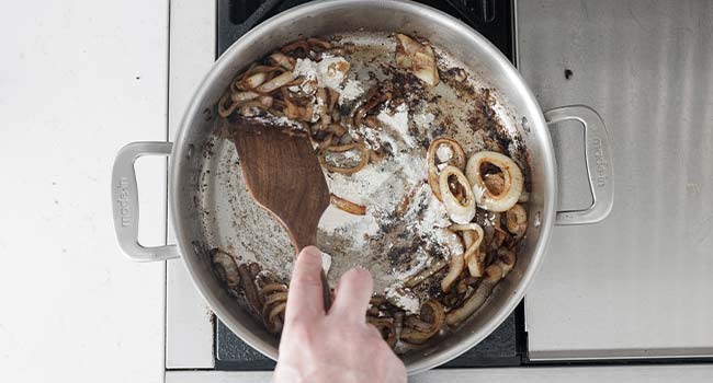 stirring flour into cooked onions