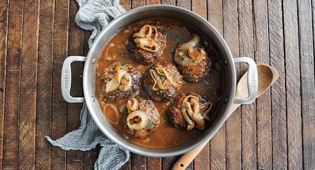 hamburger steaks with caramelized onions in gravy