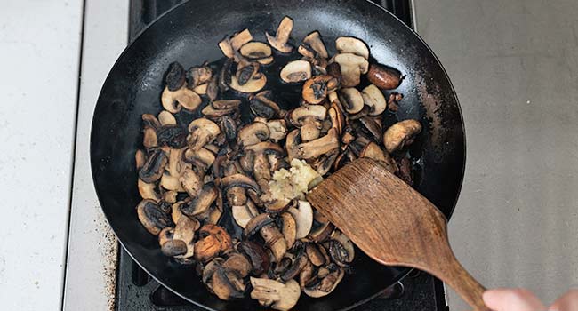 searing mushrooms in a pan