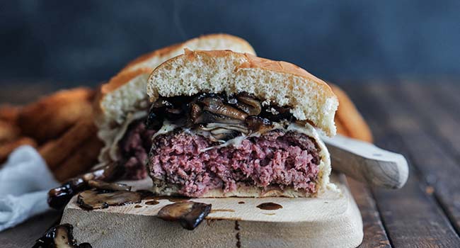 sliced mushroom swiss burger