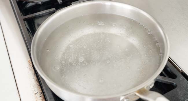 simmering water in a pot