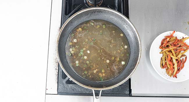 cooking chicken stock with onions and garlic