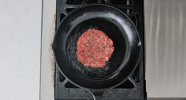 searing a burger in a pan