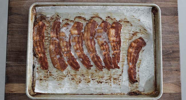 baked bacon on a sheet tray