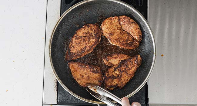 searing seasoned chicken breasts