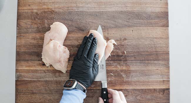 slicing chicken in half