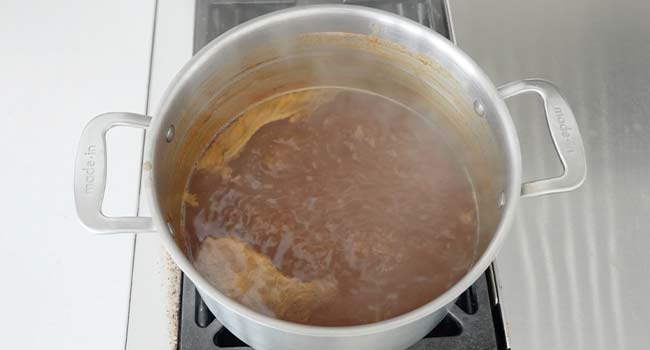 reducing glace de viande in a pot