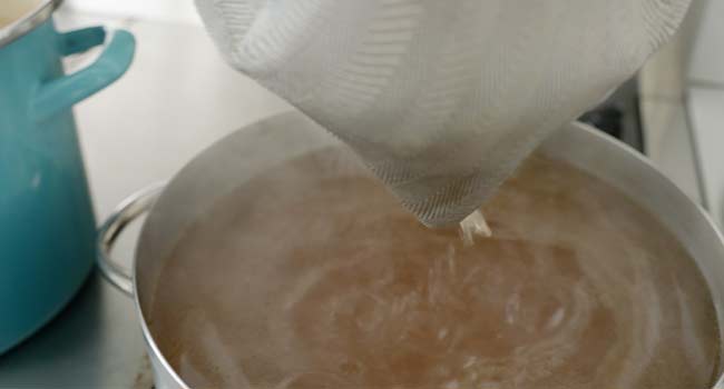 straining a broth