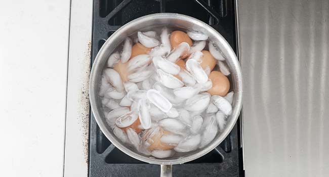 chilling eggs in an ice bath